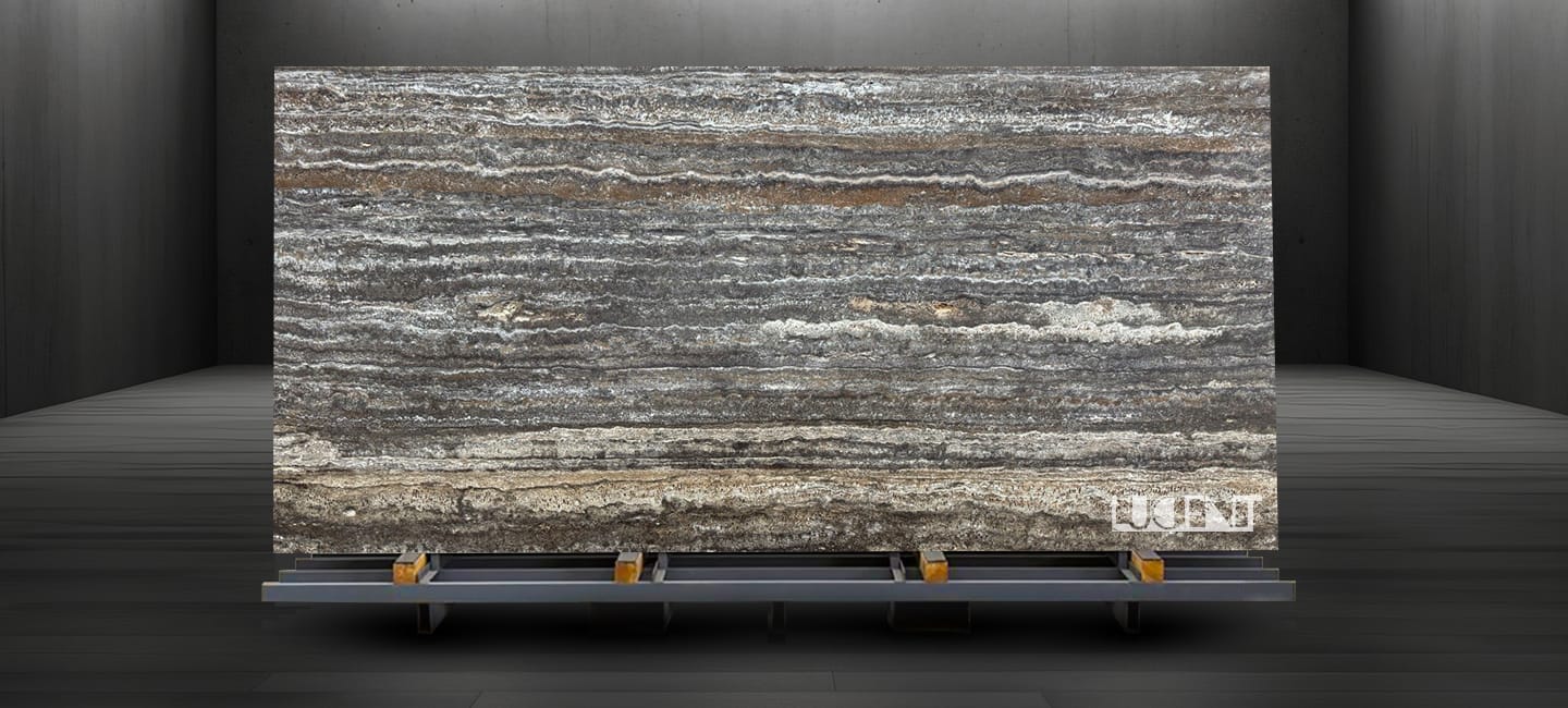 Silver Travertine slab displayed on a holder, showcasing its natural silver-gray veining and texture.