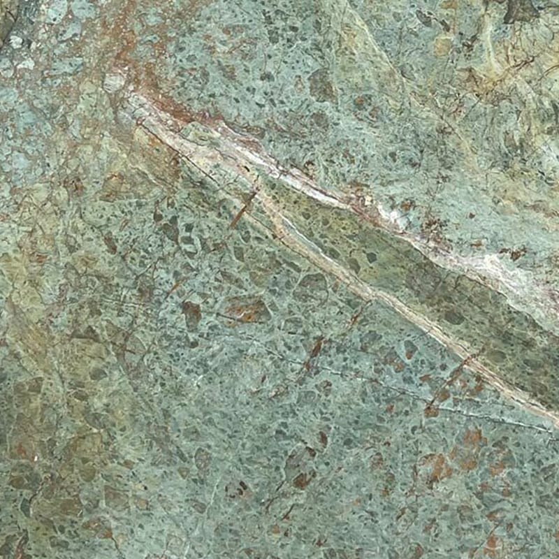 Close-up view of Turquoise Granite's intricate veining pattern in turquoise, white, and gray.