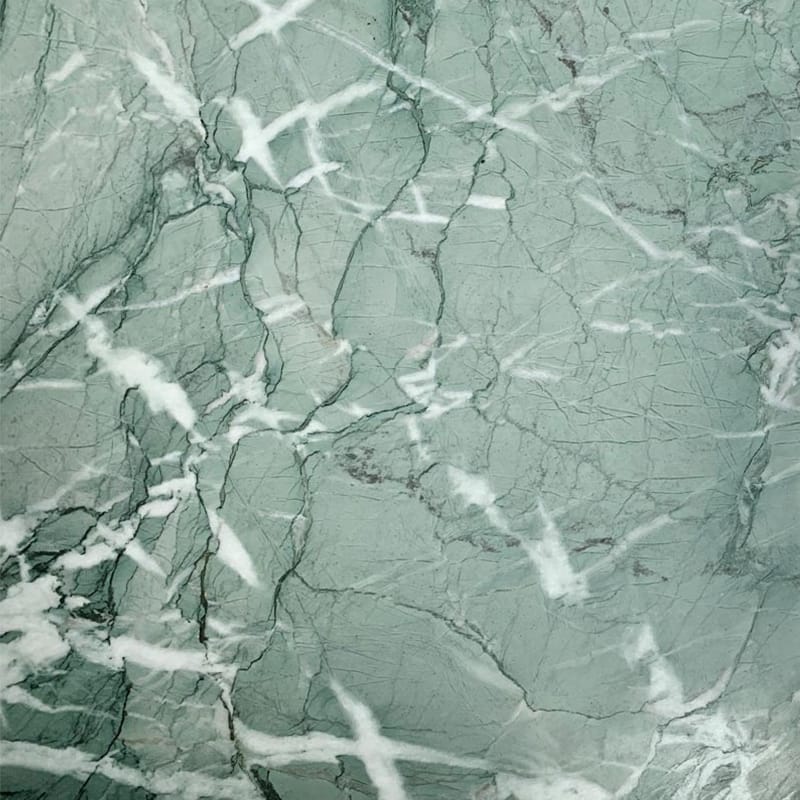 Close-up texture of Verde Antigua Marble showing green tones and natural veining
