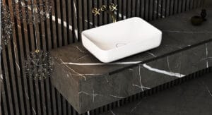 Luxurious bathroom featuring Pietra Gray Marble on walls and vanity, creating a modern and sophisticated look.