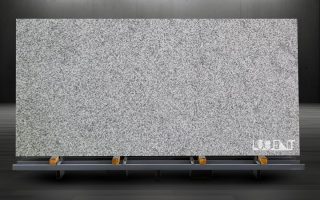 Classic Grey Granite Slab on Metal Rack – Export Ready Classic Grey Granite slab placed on metal holder ready for export or fabrication