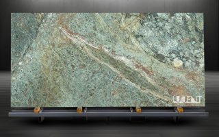 Turquoise Granite Slab Display Turquoise Granite slab mounted on holder, showcasing its vibrant turquoise hues and intricate veining.